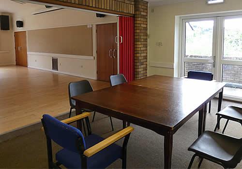 Photo Gallery Image - Folding tables and chairs are available for use in the Committee Room